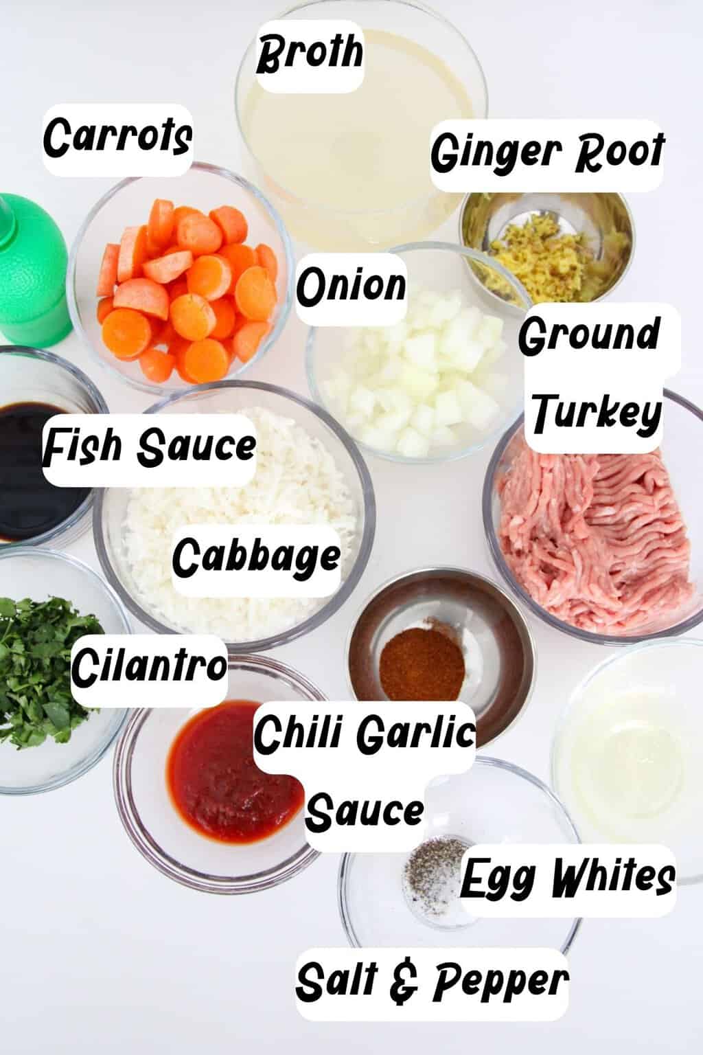 Ingredients: Chili garlic sauce, Ground turkey, Onion, Egg, Ginger root, Cilantro, Black pepper and salt, Chicken broth, Napa cabbage, Carrot, Fish sauce.