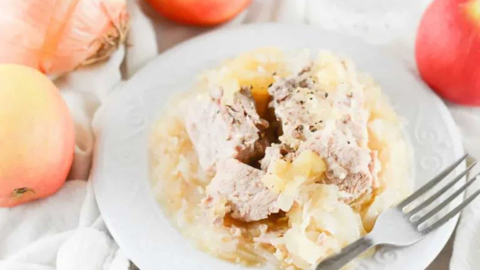 A plate of sauerkraut and pork.