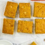 Pumpkin blondies sitting on a counter.