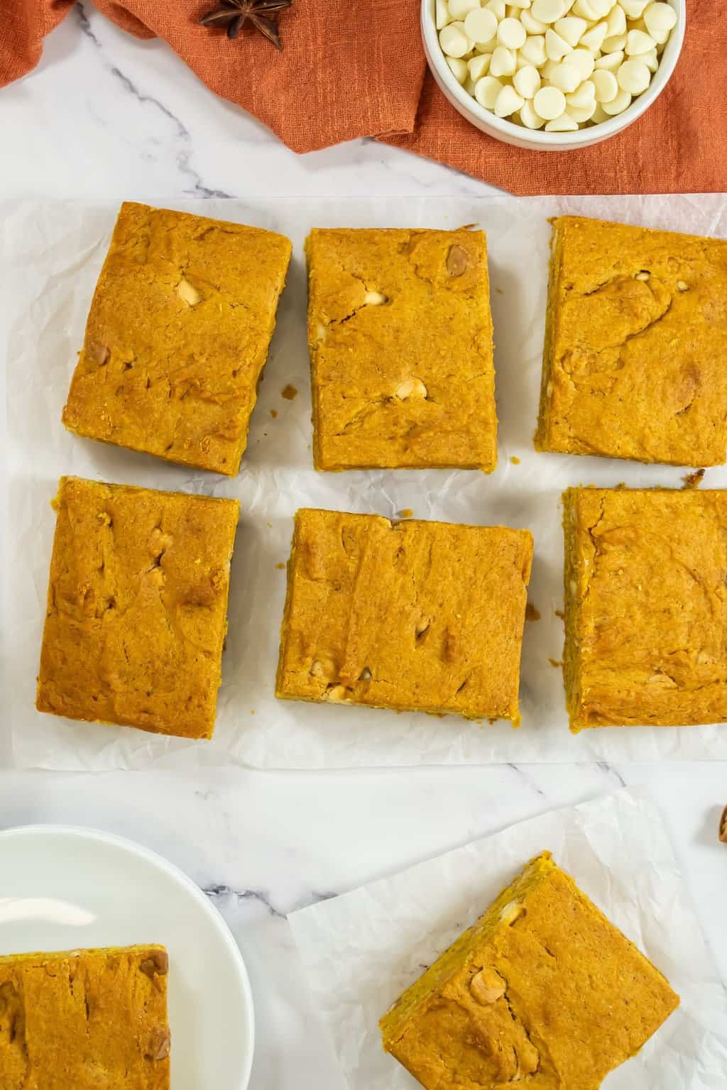 Pumpkin blondies sitting on a counter.