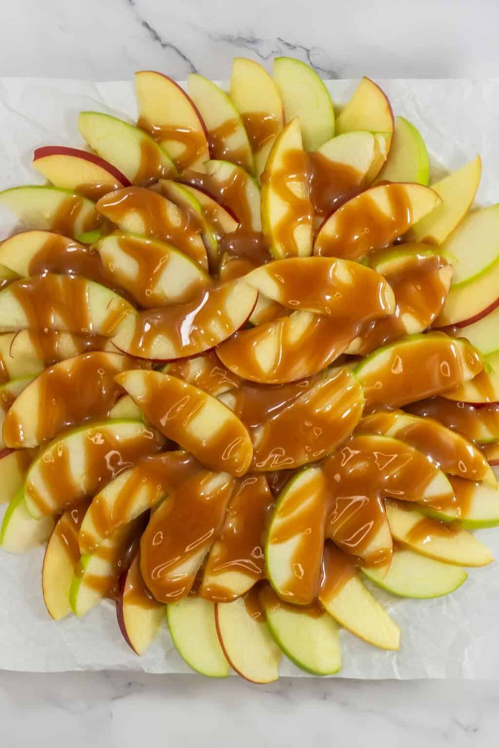 Apple slices drizzled with caramel.