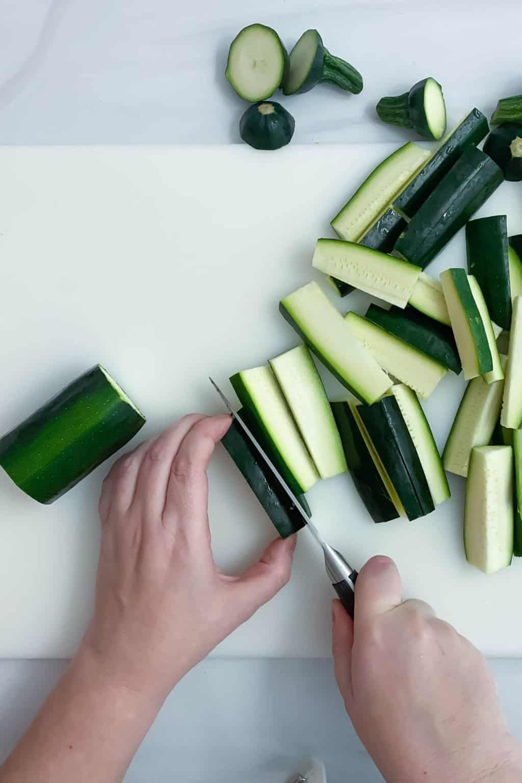 Cutting zucchini from above.