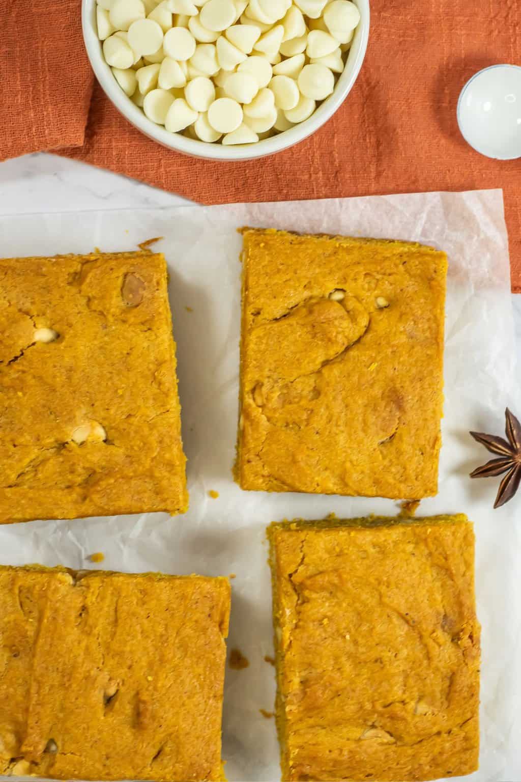 Slices of blondies with white chocolate chips.