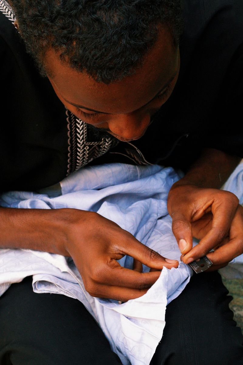 Mending Clothes by Hand