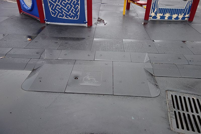 Metal Slides On Asphalt Became Rubberized, Inclusive Playgrounds