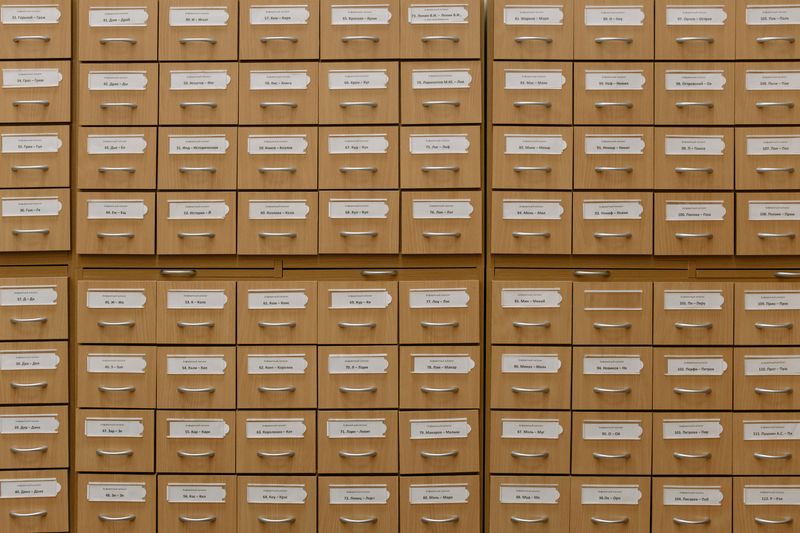 Searching Through Library Card Catalog Drawers