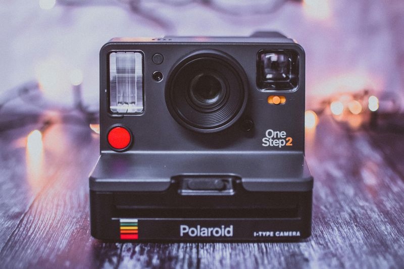 Waiting For Photos From A Polaroid Camera