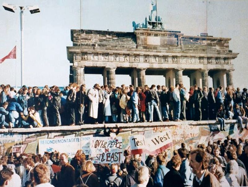 People Atop The Berlin Wall (1989)