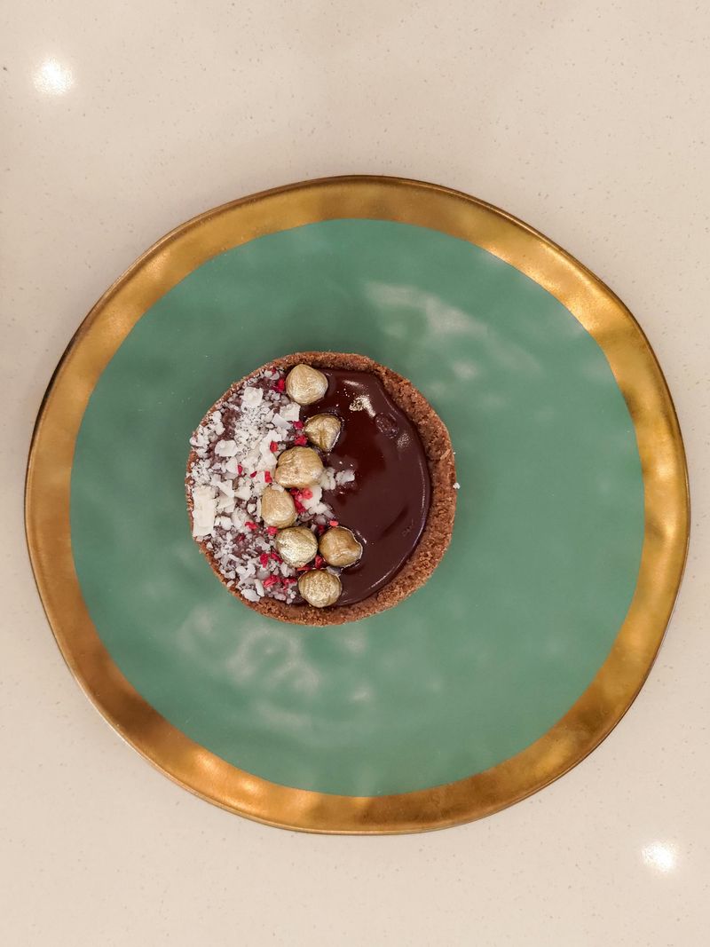 Chocolate Tart with Pomegranates and Hazelnuts
