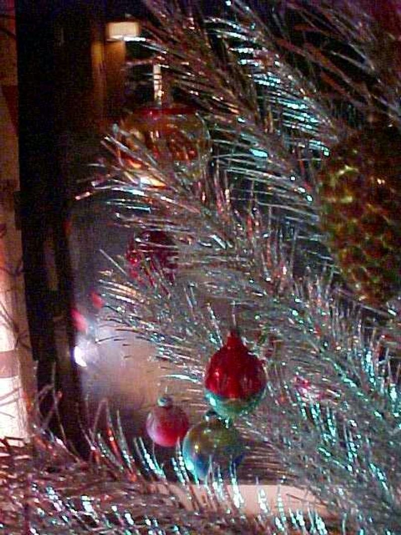 Setting Up Shiny Aluminum Christmas Trees With Color Wheels