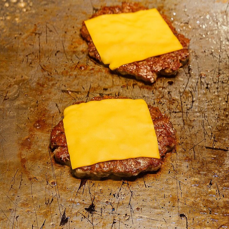 Layer Sharp Cheese During Final Minute