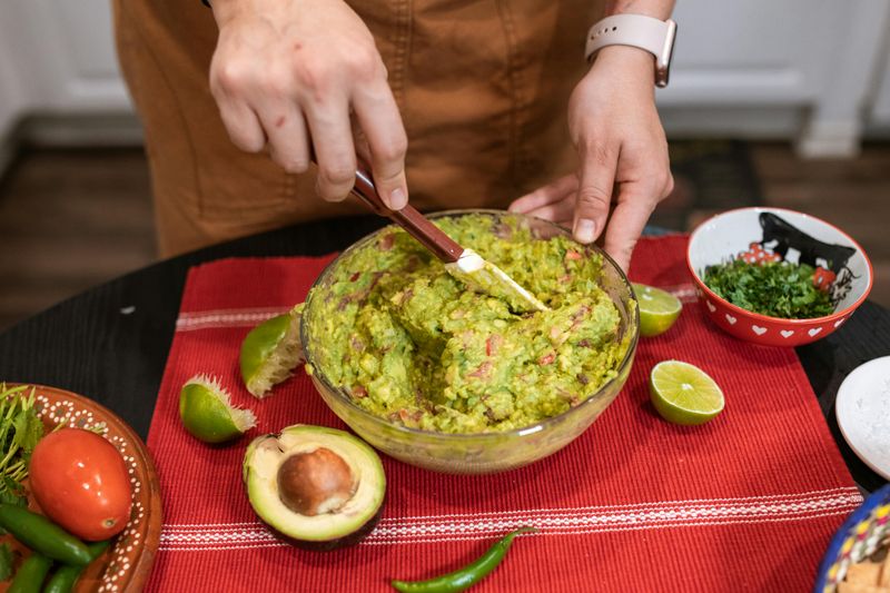 Avocado Mash with Lime and Crushed Red Pepper on Crackers